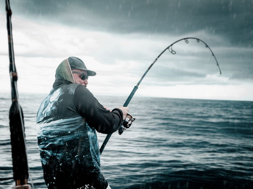 Fighting a fish in a squall, Guam